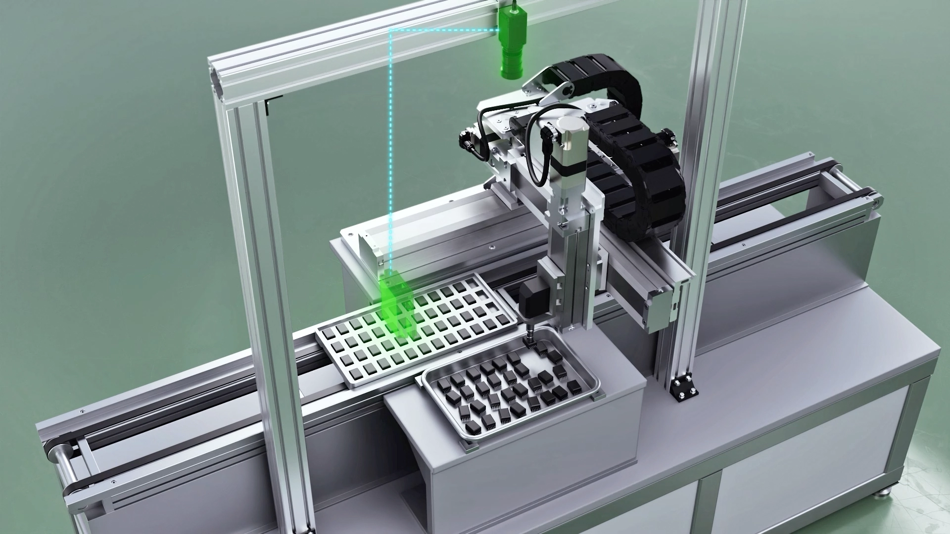An automated device in which an aluminum frame gantry robot performs precision picking work from black and white parts trays using a green laser guide